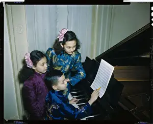 Children Practicing on Piano