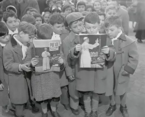 Children Reading Pamphlets