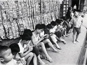 Learning Prints: Children Reading Under Row Of Books