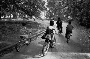 Henri Silberman Collection Gallery: Children riding bicycles on path