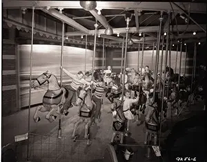Amusement Park Prints: Children Riding Carousel Horses