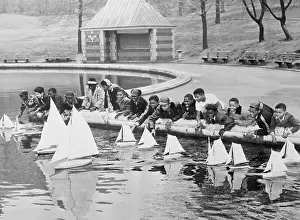 Artificial Lake Prints: Children Sailing Toy Boats in Central Park
