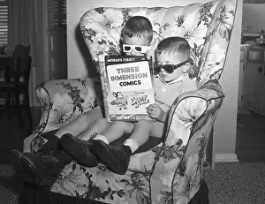 Children Sitting In Chair With 3D Comic