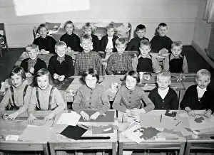 Children Sitting at Their School Desks