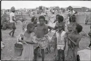 Children Smile, Camels Drink From Well