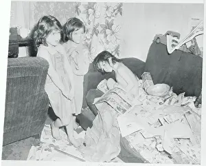 Children Standing by a Junk Strewn Couch