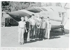 Children Standing Next to Their Rocket Ship