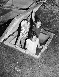 Children Testing Bomb Shelter Escape Hatch