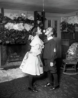 Celebrating Prints: Children Trying to Bite Apple on a String
