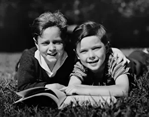 Children w / book outdoors