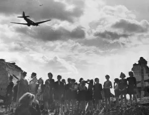 Children Watch Food Airlift Plane Arrive