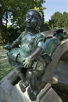 Images Dated 8th August 2014: Childs sculpture with musical instrument and fish fin on Minnesangerbrunnen fountain, art nouveau