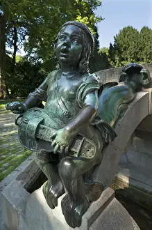 Music Instrument Prints: Childs sculpture with musical instrument and fish fin on Minnesangerbrunnen fountain