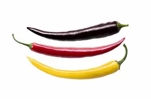 Three chili peppers in the German national colors, photo composing