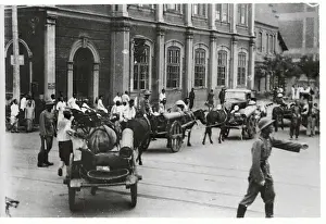 China Street with Workers Using Horse Drawn Carriages
