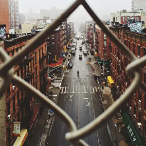 Images Dated 21st February 2014: Chinatown seen through fence on a foggy day, NYC