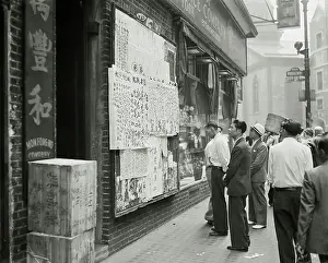 Chinese In Chinatown Look At Bulletins