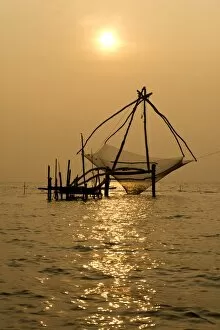 Images Dated 24th February 2013: Chinese fishing net at sunrise, Vembanad lake, Kerala, India