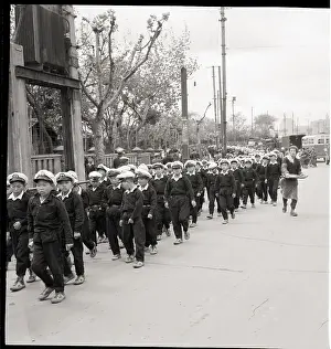 Homelessness Prints: Chinese Kids March Through Street In Uni
