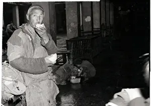 Bread Prints: Chinese Man In Tattered Clothes Eating
