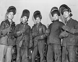 Five Chinese Men In Welder Gear, Tools