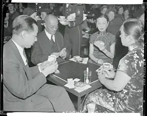 Chinese Officials Relaxing With Deck of Cards