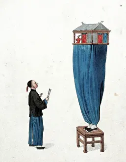 Balancing Prints: A Chinese puppeteer standing on a stool and balancing a miniature stage above him