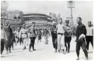 Leading Prints: Chinese Rebel Being Led Away By Police