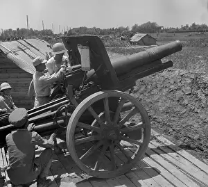 Chinese Soldiers Manning Cannon