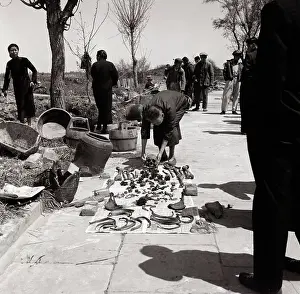 Widow Prints: Chinese Woman Arranging Husband's Bones