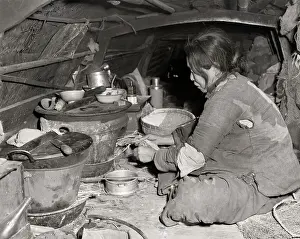 Chinese Woman Seated Preparing Food