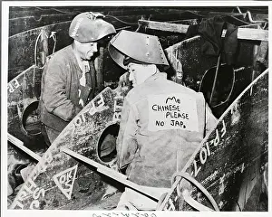 Chinese Workman Wearing Sign On His Back