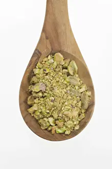 Spoon Prints: Chopped Pistachio (Pistacia vera) nuts on an olive wood spoon