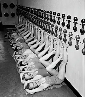 Gymnasium Prints: Chorus Girls Doing Leg Exercises at Gym