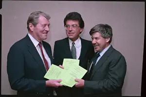 Christian Alfinsen Holding a Legal Brief with Colleagues