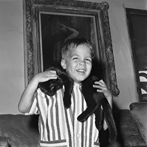 Christian Brando Playing with a Cat