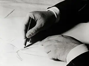 Christian Dior Sketching a Dress