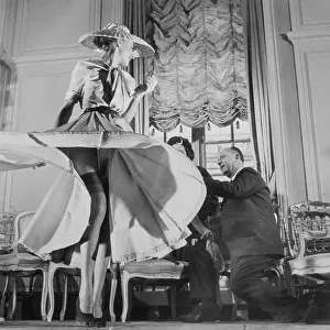 Christian Dior with Woman Modeling Dress and Stockings