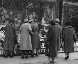 Prints of A group of women window shopping in Regent Street, London. (Photo by Fox Photos/Getty Images) Timeless Treasures: Iconic Black and White Prints from the Fox Photo Library: Christmas Shoppers