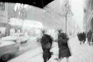 Prints of PHILADELPHIA, PENNSYLVANIA - CIRCA 1963 Celebrate the Season: A Curated Collection of Christmas Art: Christmas Shoppers in the Snow in 1963