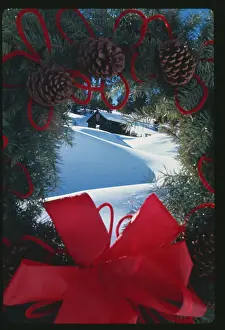 Christmas Wreath Framing a Snowy Hillside Scene
