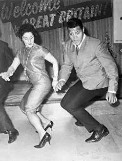 Chubby Checker Twists With Woman