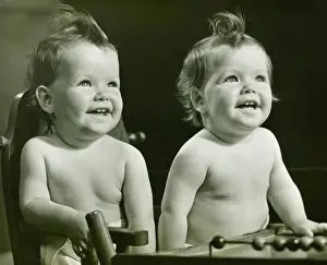 6 11 Months Prints: Two chubby twin sisters (9-12 months) sitting at home, (B&W)