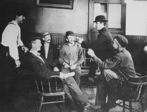 Easy Chair Prints: Chuck Connors Talking with Friends in Saloon