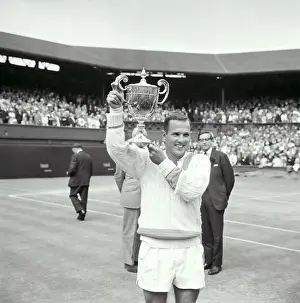 Chuck McKinley Holding Wimbledon Trophy