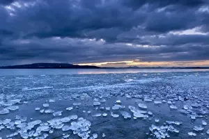Lakeside Prints: Chunks of ice lying on icy surface on the shore of Reichenau Island