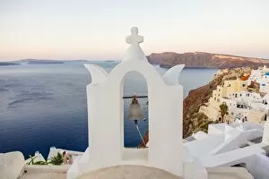 Volcano Collection: Church bell tower in Oia village, Santorini, Cyclades, Greece