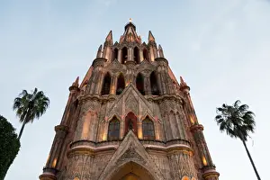 Church building with palm trees on either side