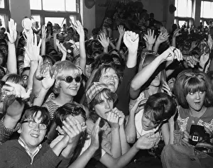 Fans Prints: Circa mid 60s fans scream their appreciation for a rock and roll band on American Bandstand