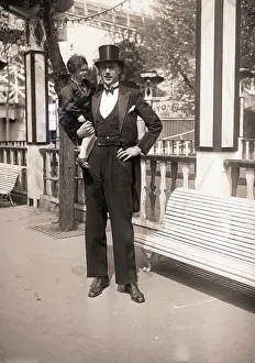 Circus Giant Holding Dwarf Woman
